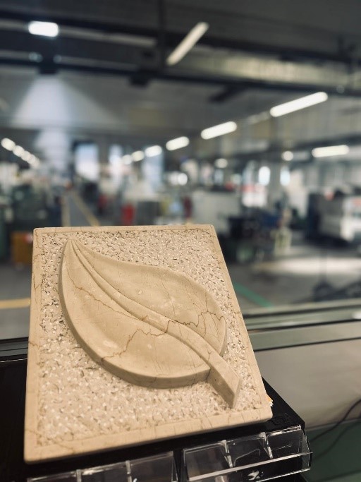 Hand-carved marble bas-relief realized through sculpture workshop for blind and visually impaired people at Vantini School in Rezzato (Brescia)