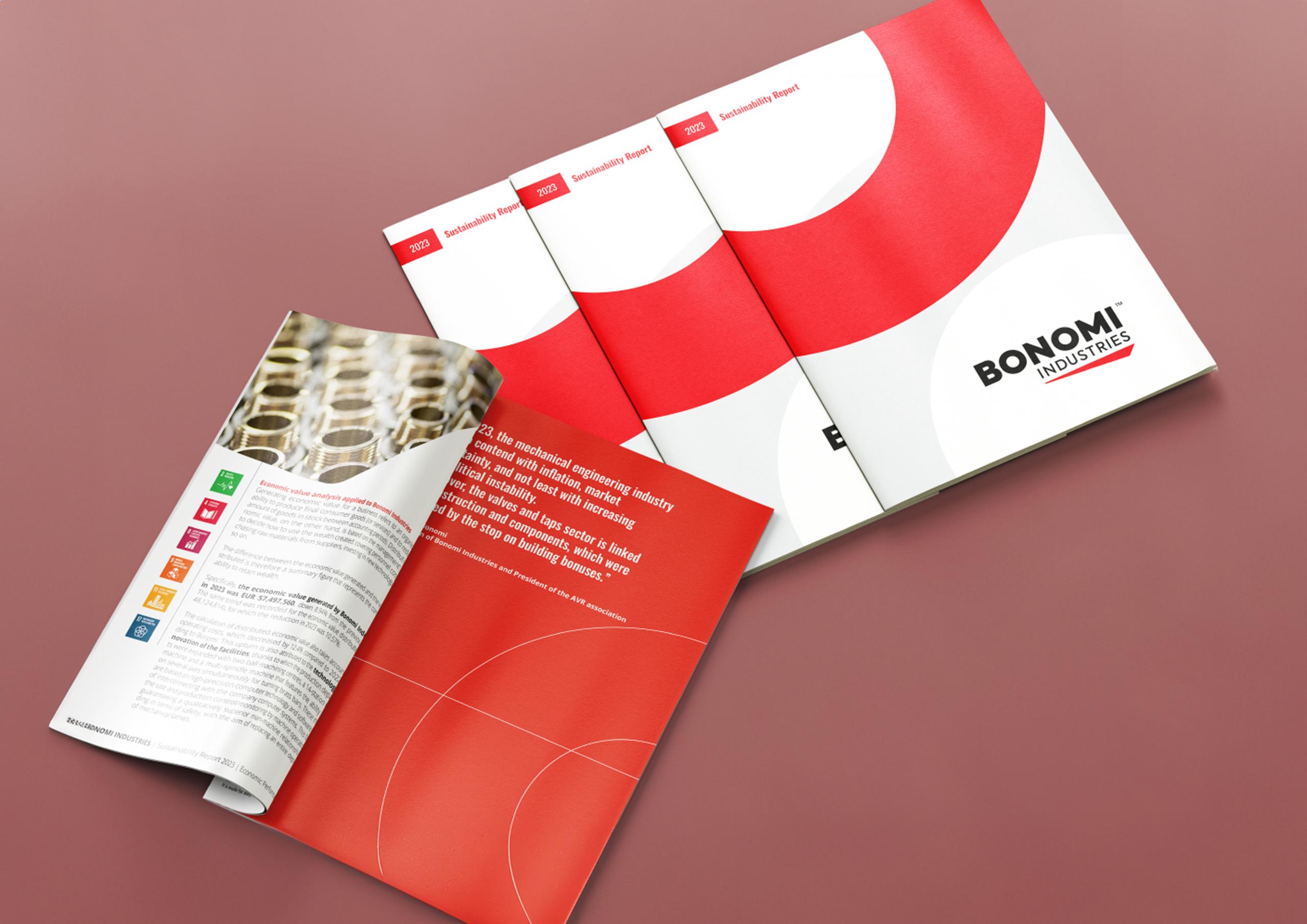 Image showing multiple copies of the Bonomi Industries' first Sustainability Report (2023). The reports have a clean, modern design with a red and white color scheme and the Bonomi Industries logo prominently displayed. One of the reports is open, revealing text and icons representing various sustainability goals. Image showing multiple copies of the Bonomi Industries' first Sustainability Report (2023). The reports have a clean, modern design with a red and white color scheme and the Bonomi Industries logo prominently displayed. One of the reports is open, revealing text and icons representing various sustainability goals.