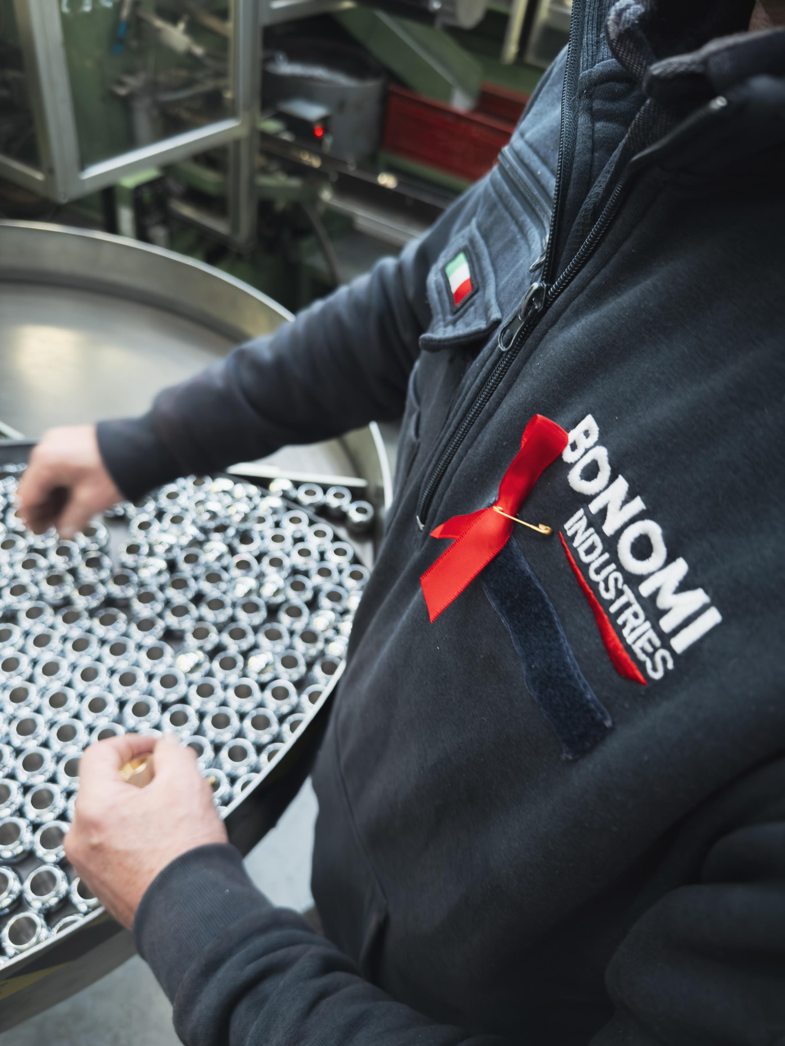 Bonomi Industries' employees wore a red ribbon on the International day for the elimination of violence against women